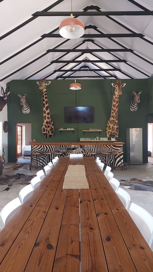 Long wooden dining table set for the hunting party