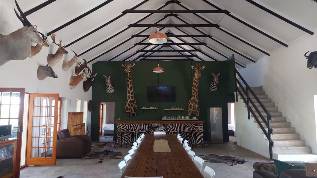 Long table running the length of the hall, with stairs up to the loft