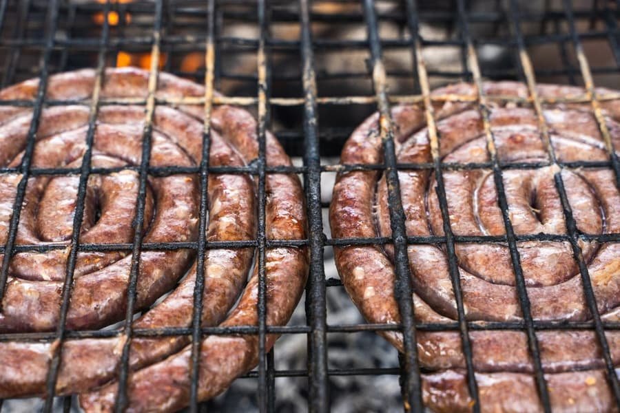 Boerewors on the braai grid over hot coals