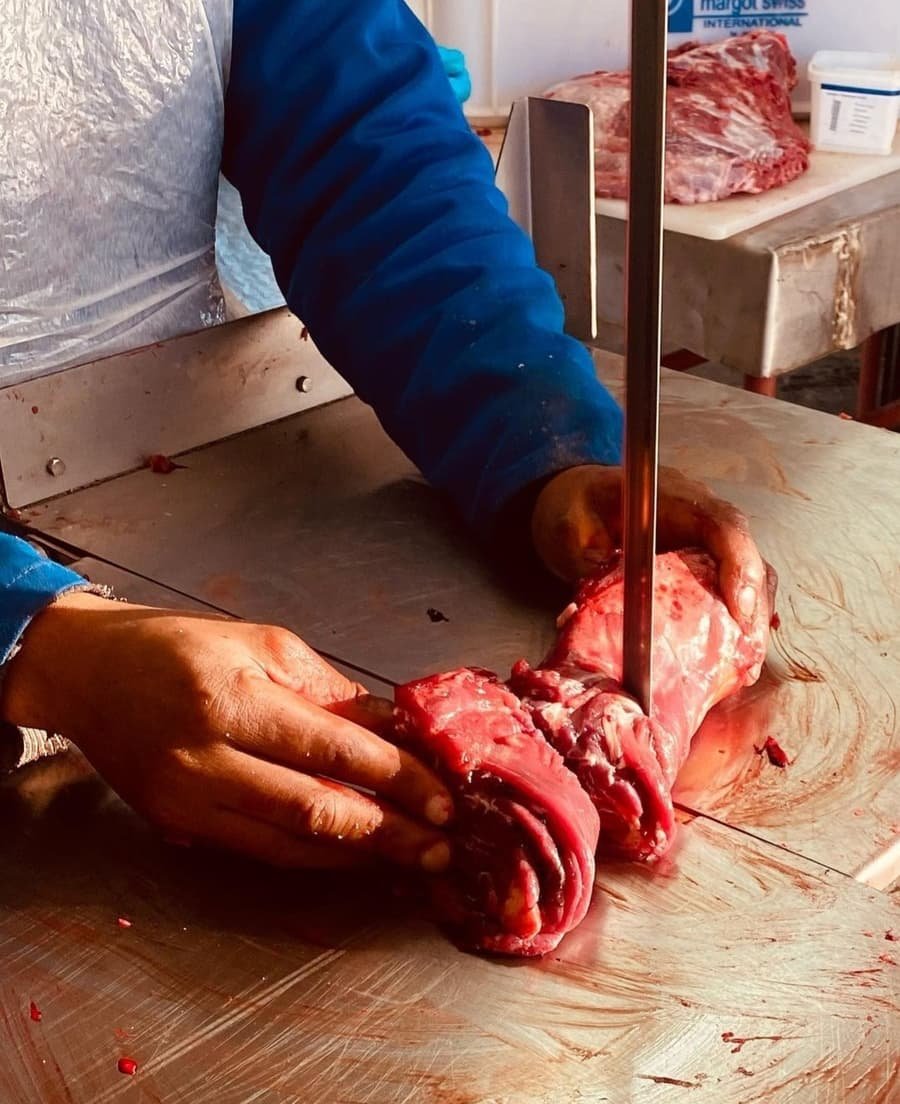 Game meat being cut on the band saw at Die Slaghuis